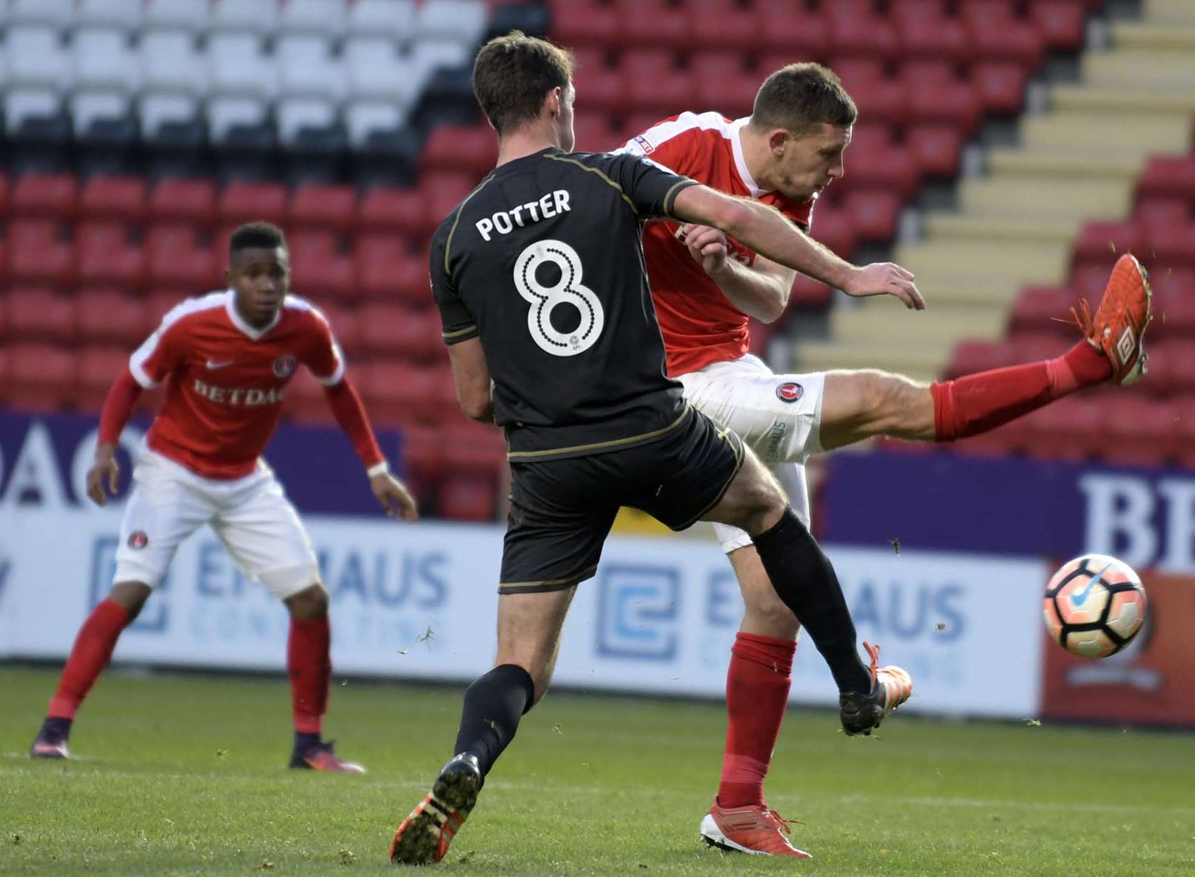 Charlton and MK Dons battle for possession. Picture: Barry Goodwin