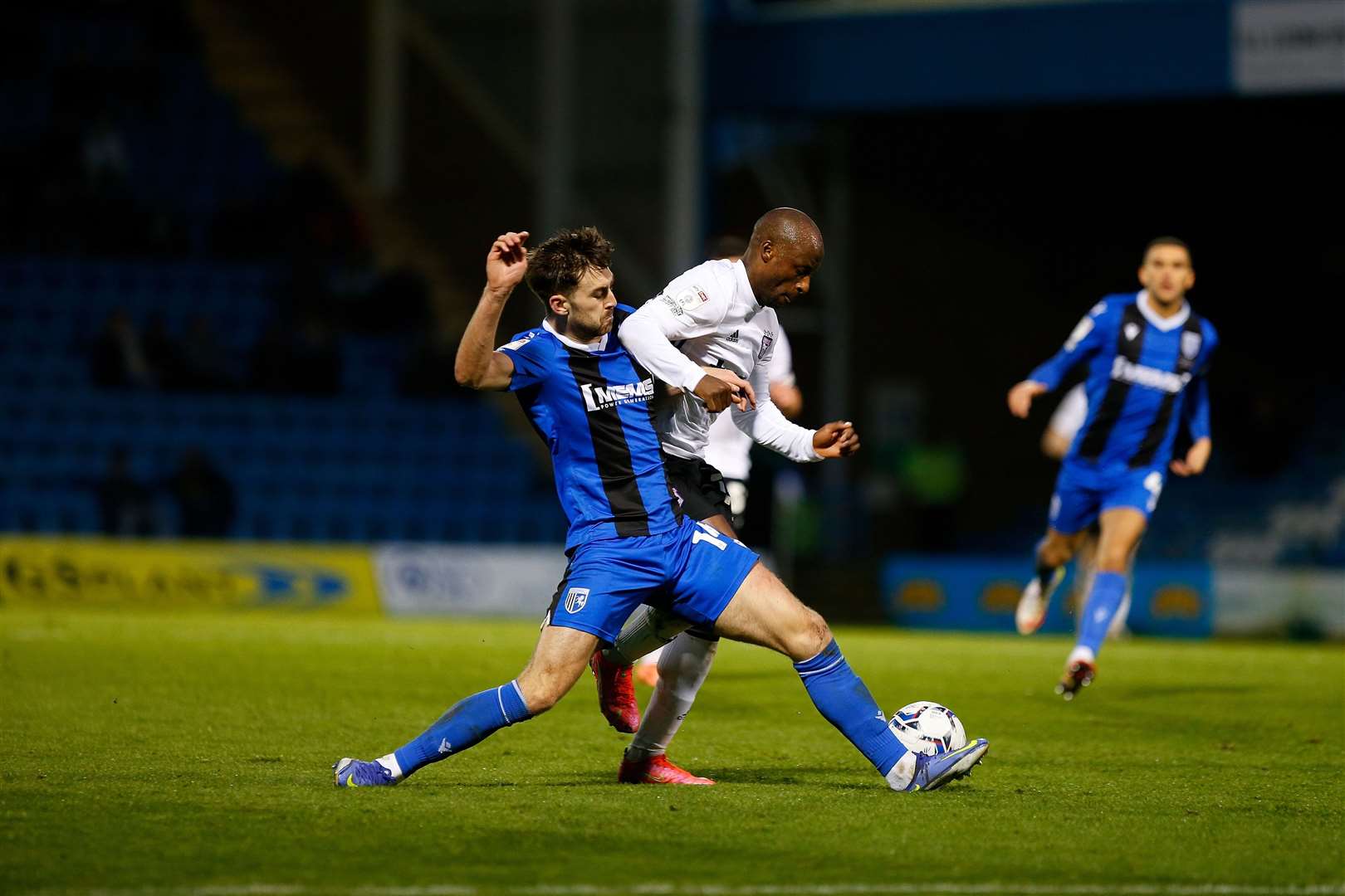 Robbie McKenzie puts in a challenge on Ipswich forward Sone Aluko Picture: Andy Jones