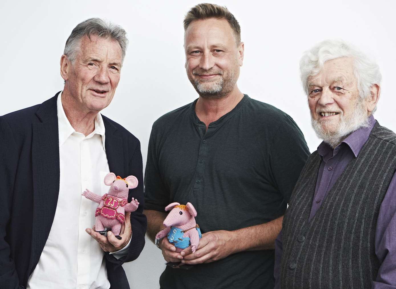 Michael Palin, who narrates the new version of The Clangers, with Dan Postgate and original creator Peter Firmin