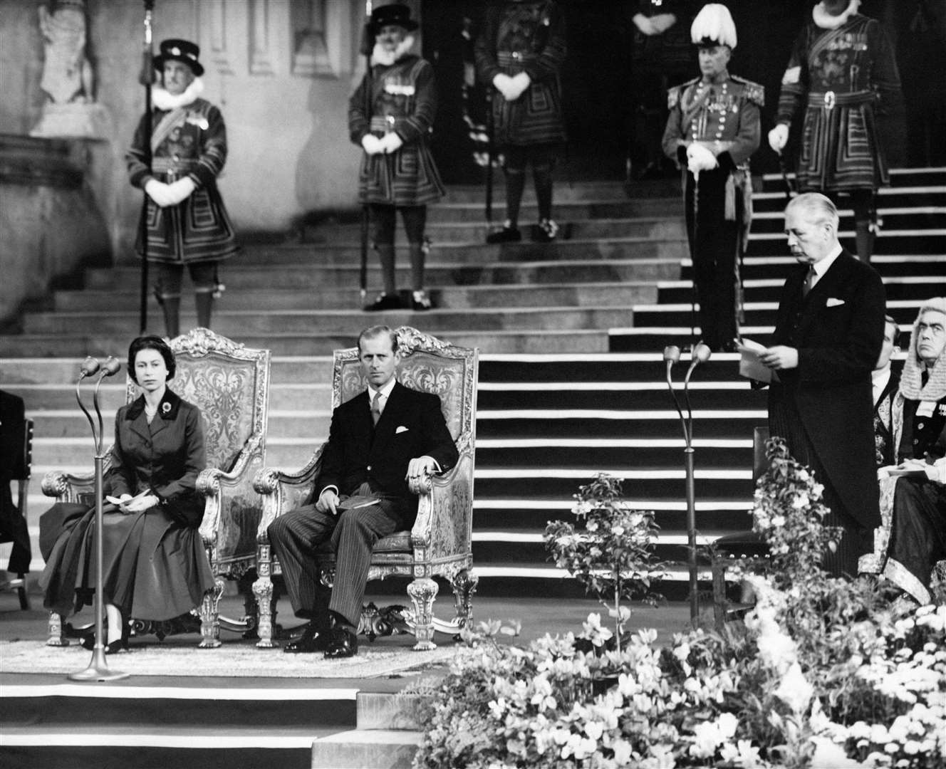 The Queen and Duke of Edinburgh listen as Harold Macmillan delivers his speech at the Inter-Parliamentary Conference in London’s Westminster Hall in 1957 (PA)