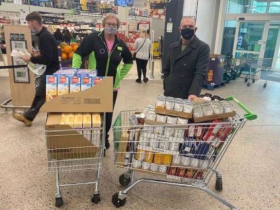 ASDA Greenhithe community champion Bridget Sparks with Galaxy Trust boss Garry Ratcliffe collecting donations for their half-term food bank