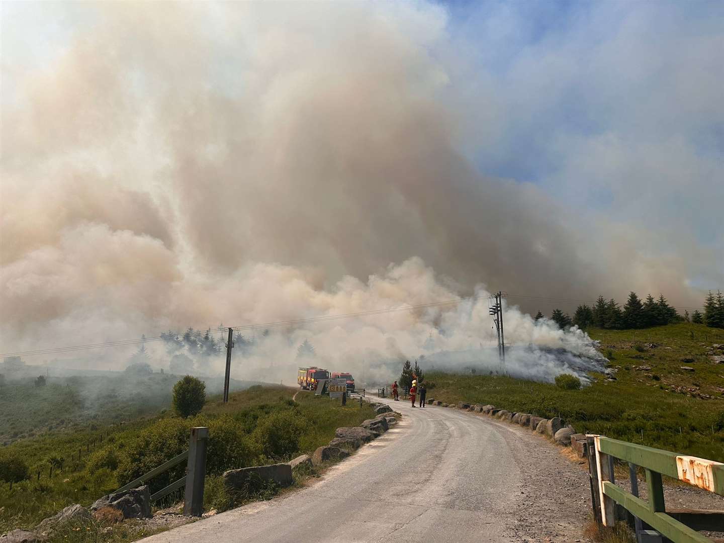 Smoke billowing across a road on the Rhigos Mountain, where a large fire has been burning for almost a week (SWFRS/PA)
