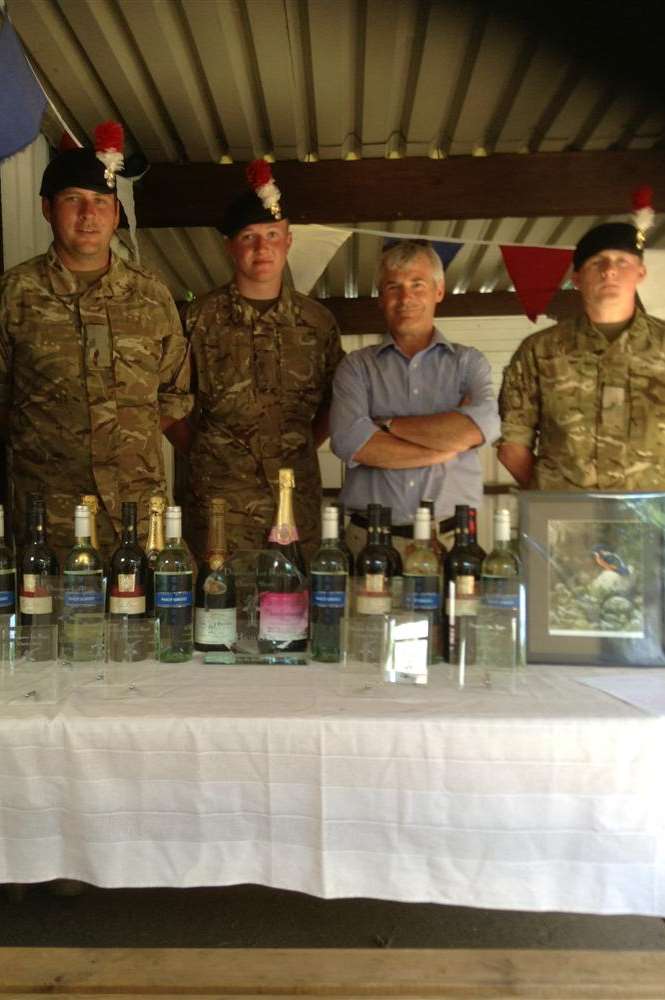 Soldiers from 1st Battalion Royal Fusiliers and Mr Harris, assistant regimental secretary