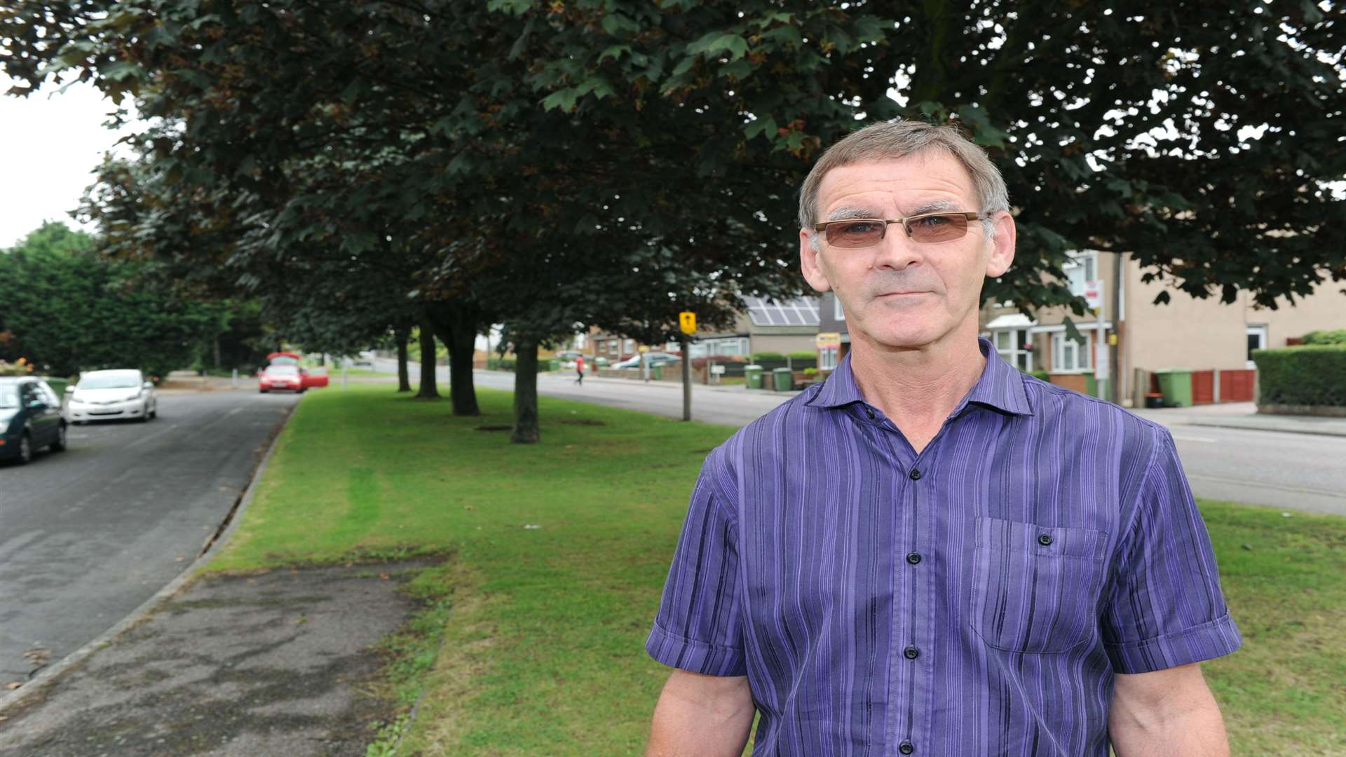 Trevor Dockerill is puzzled green space in front of his home is up for auction