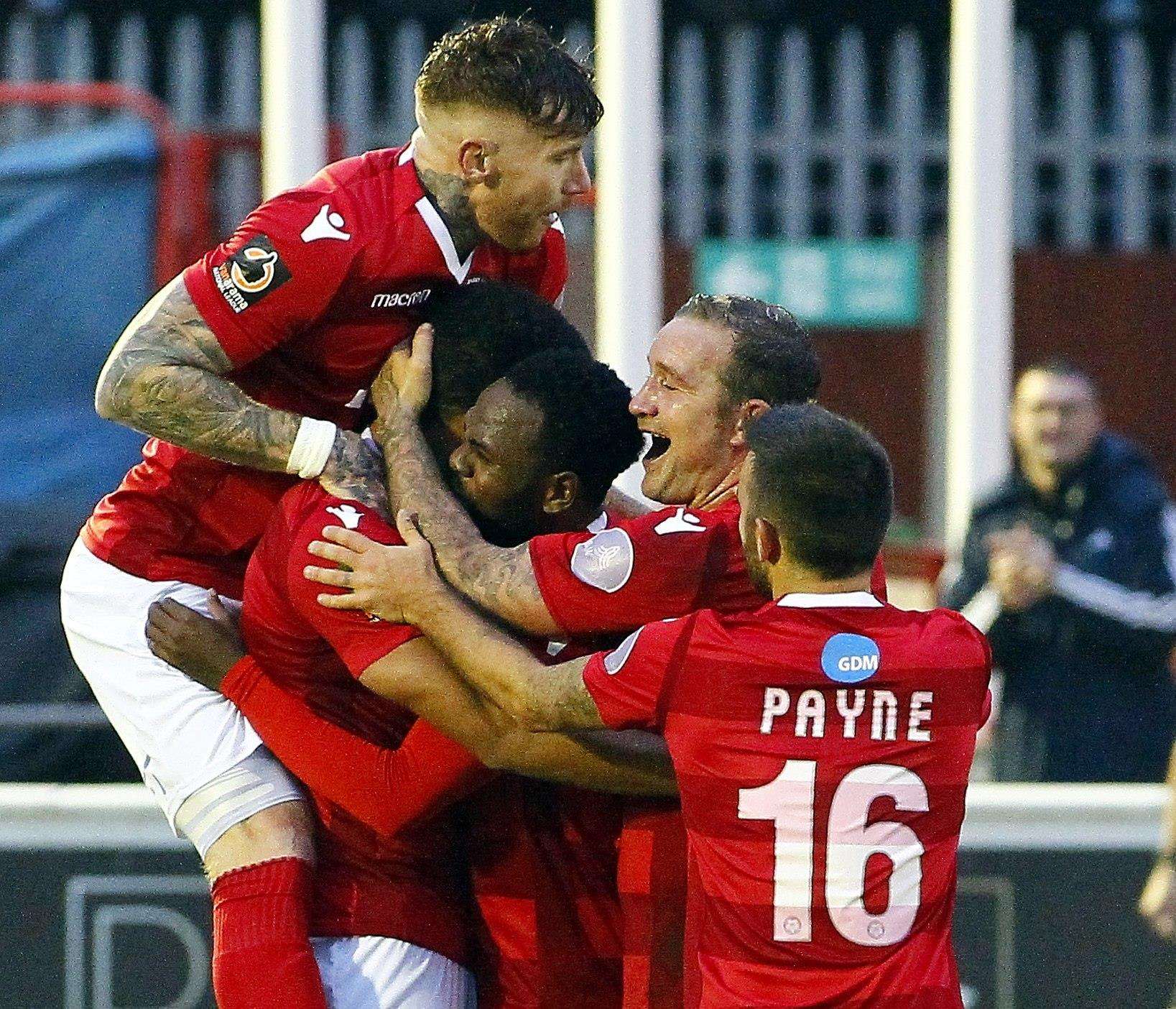 Chris Bush is mobbed after scoring Ebbsfleet's second goal Picture: Sean Aidan