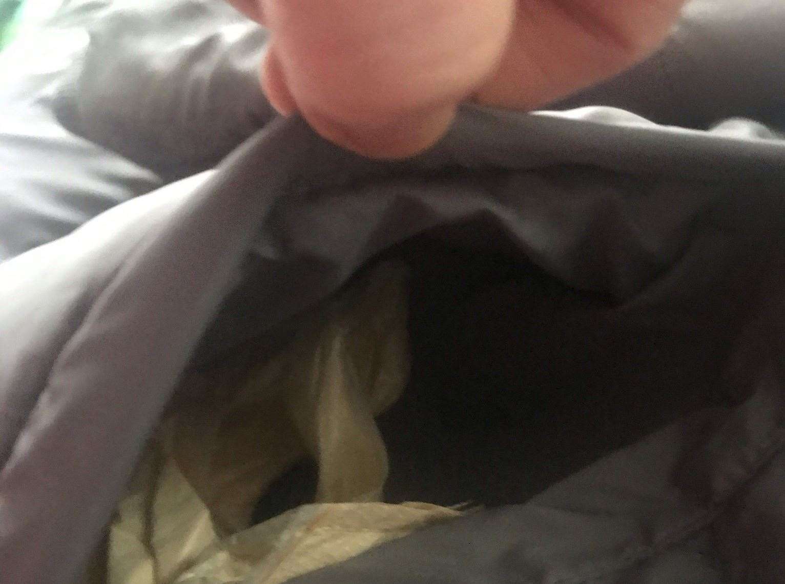 Mum Anna Busby, from Gillingham, finds dirty tissues and nappy sacks in pockets of new coat from JD Sports bought online. Picture: Anna Busby