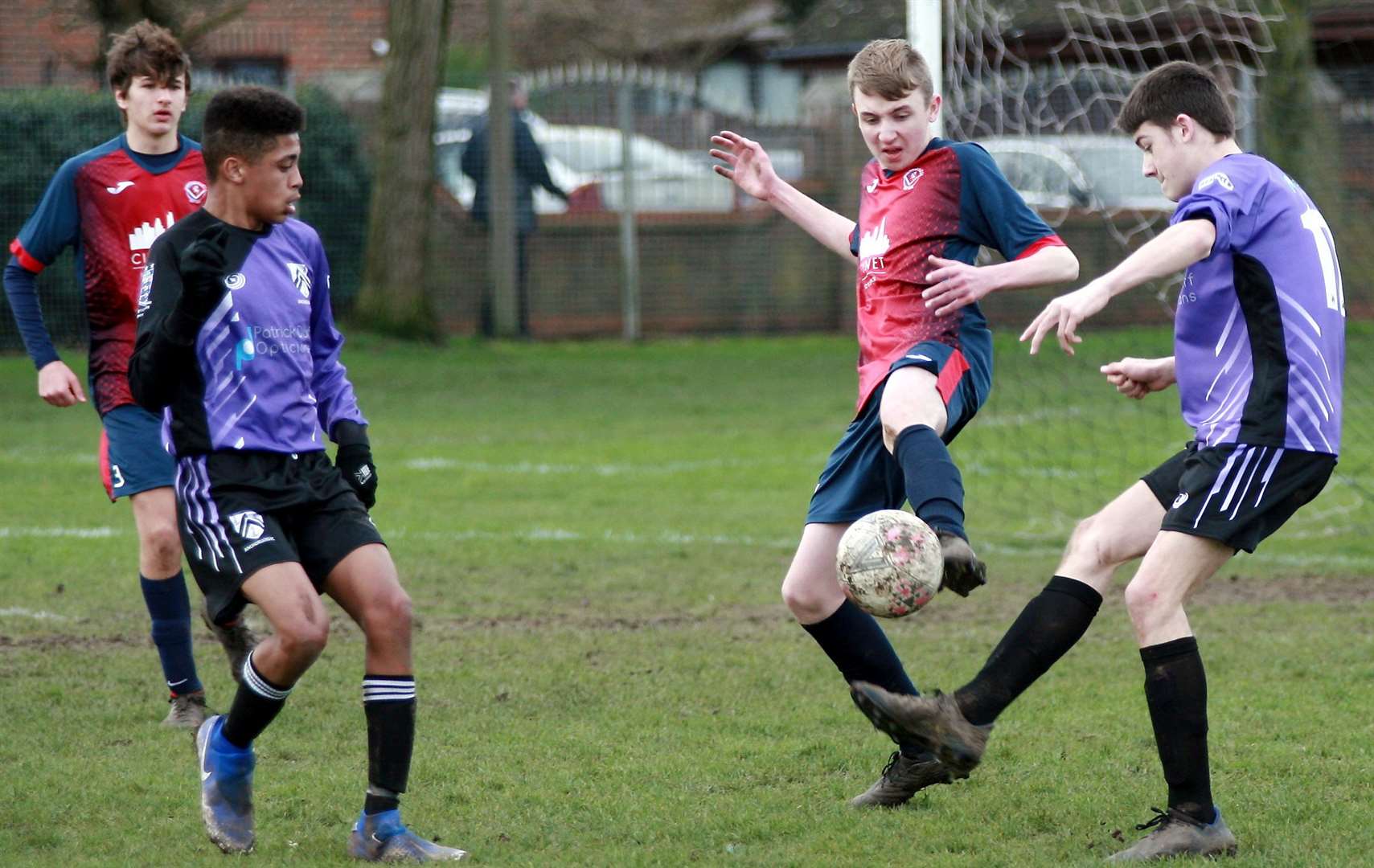 Hempstead Valley under-16s (red) put their foot in against Anchorians United under-16s on Sunday. Picture: Phil Lee FM28210079