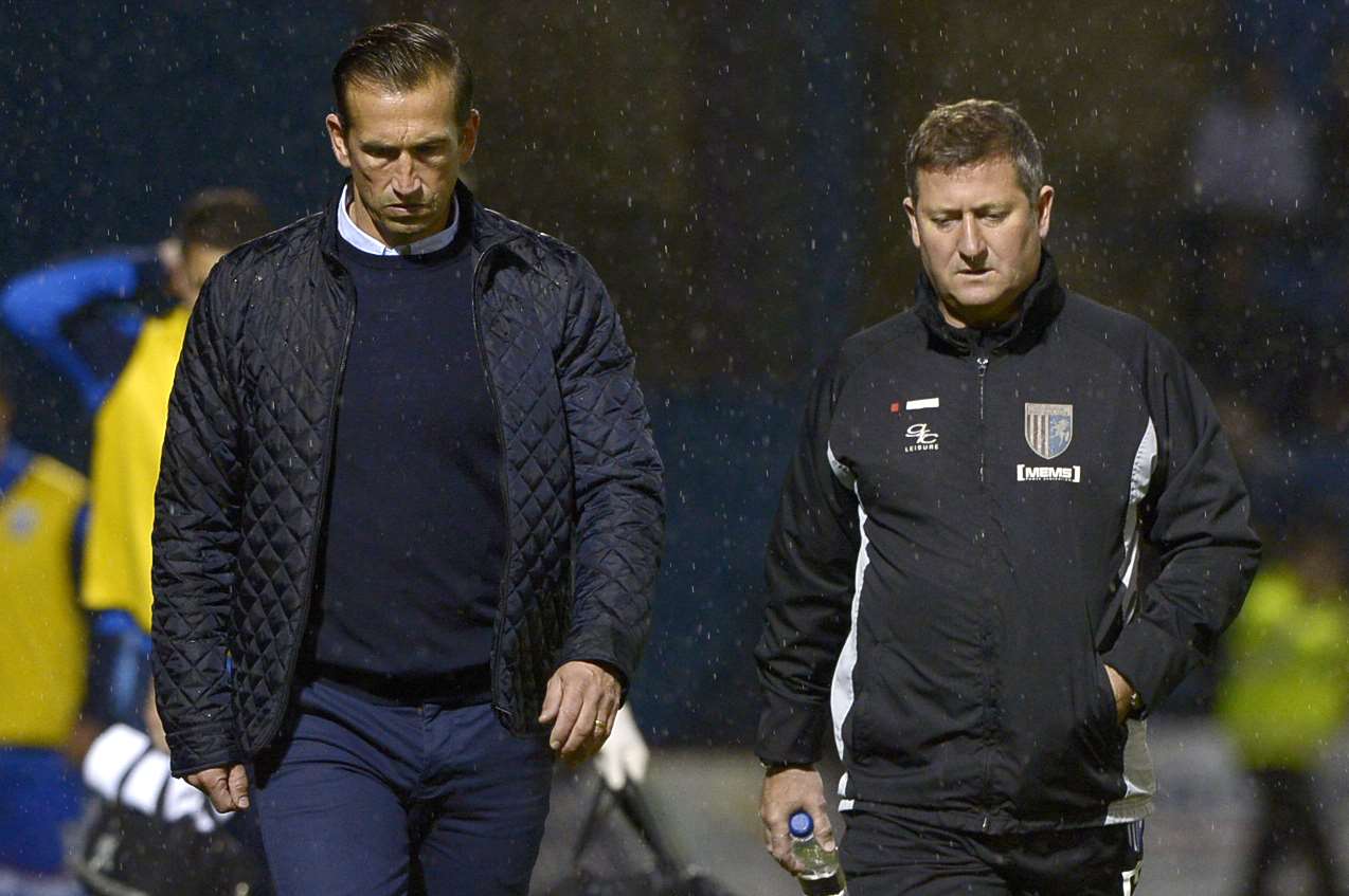 Gills boss Justin Edinburgh and assistant manager David Kerslake ponder the display against Luton on Tuesday Picture: Barry Goodwin