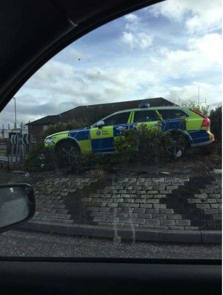A police car parked on one of the roundaouts at Kingsmead Road, Canterbury. Picture Darsy Dabden