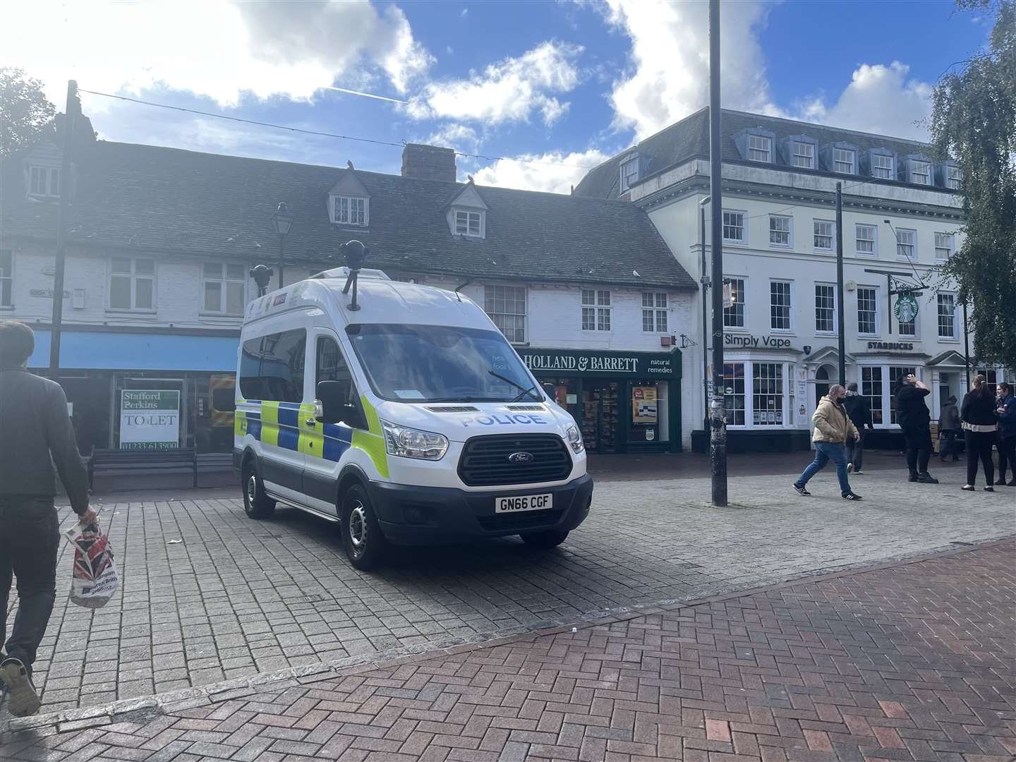 A police van was parked in the high street at lunchtime on Tuesday