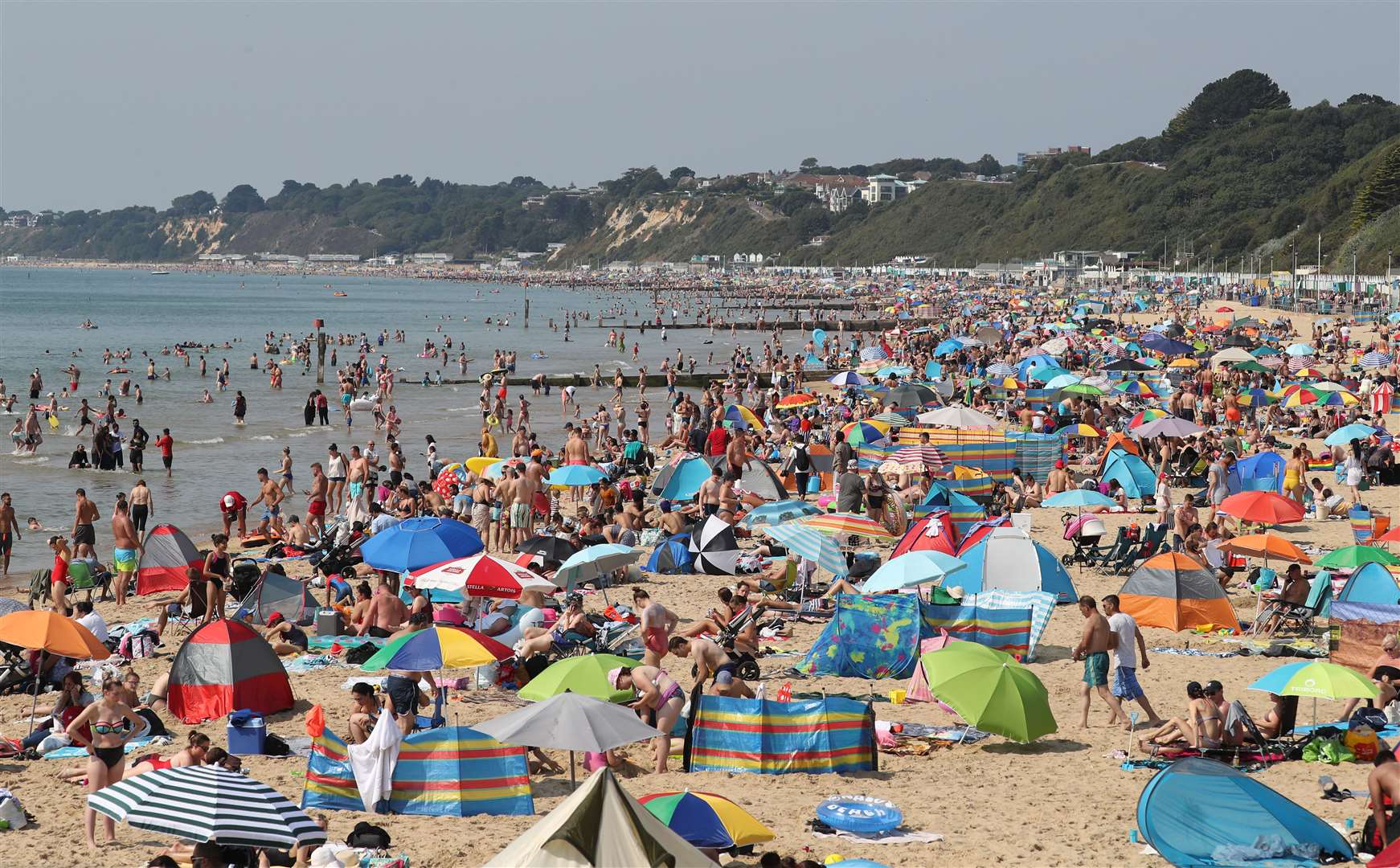People enjoy the hot weather at Bournemouth beach in Dorset (Andrew Matthews/PA)