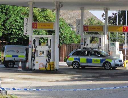 Police seal off the Shell petrol station at Macknade on Tuesday morning following a suspected burglary.