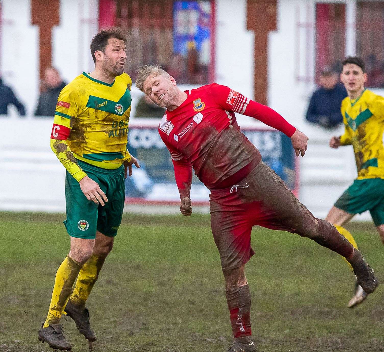 Whitstable's Harry Goodger contests for the ball with Ashford's Liam Friend. Picture: Les Biggs