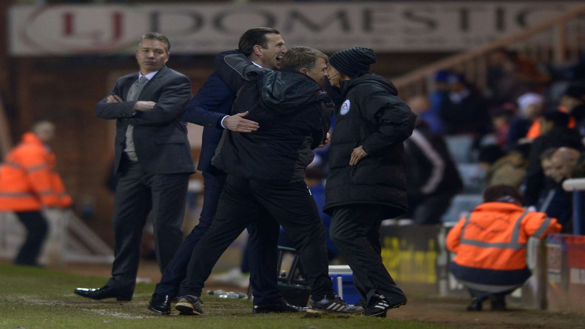 Justin Edinburgh celebrates his first win, at Peterborough, with assistant Andy Hessenthaler Picture: Barry Goodwin