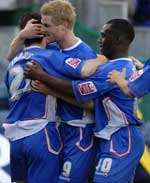 Gillingham's players celebrate their winner. Picture: GRANT FALVEY