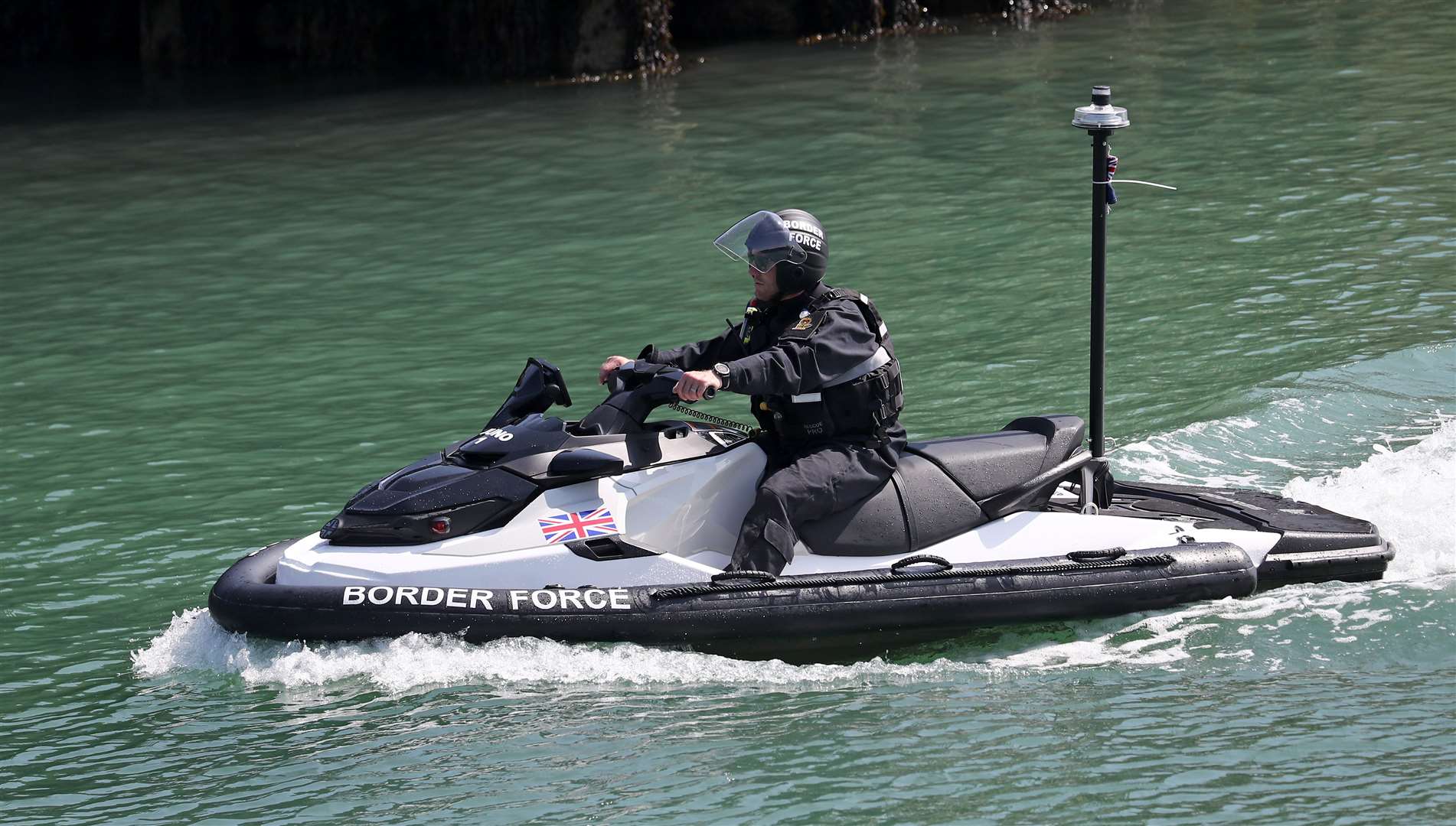 A Border Force officer arrives on a jet ski into Dover, Kent, following a small boat incident in the Channel on Thursday (Gareth Fuller/PA)