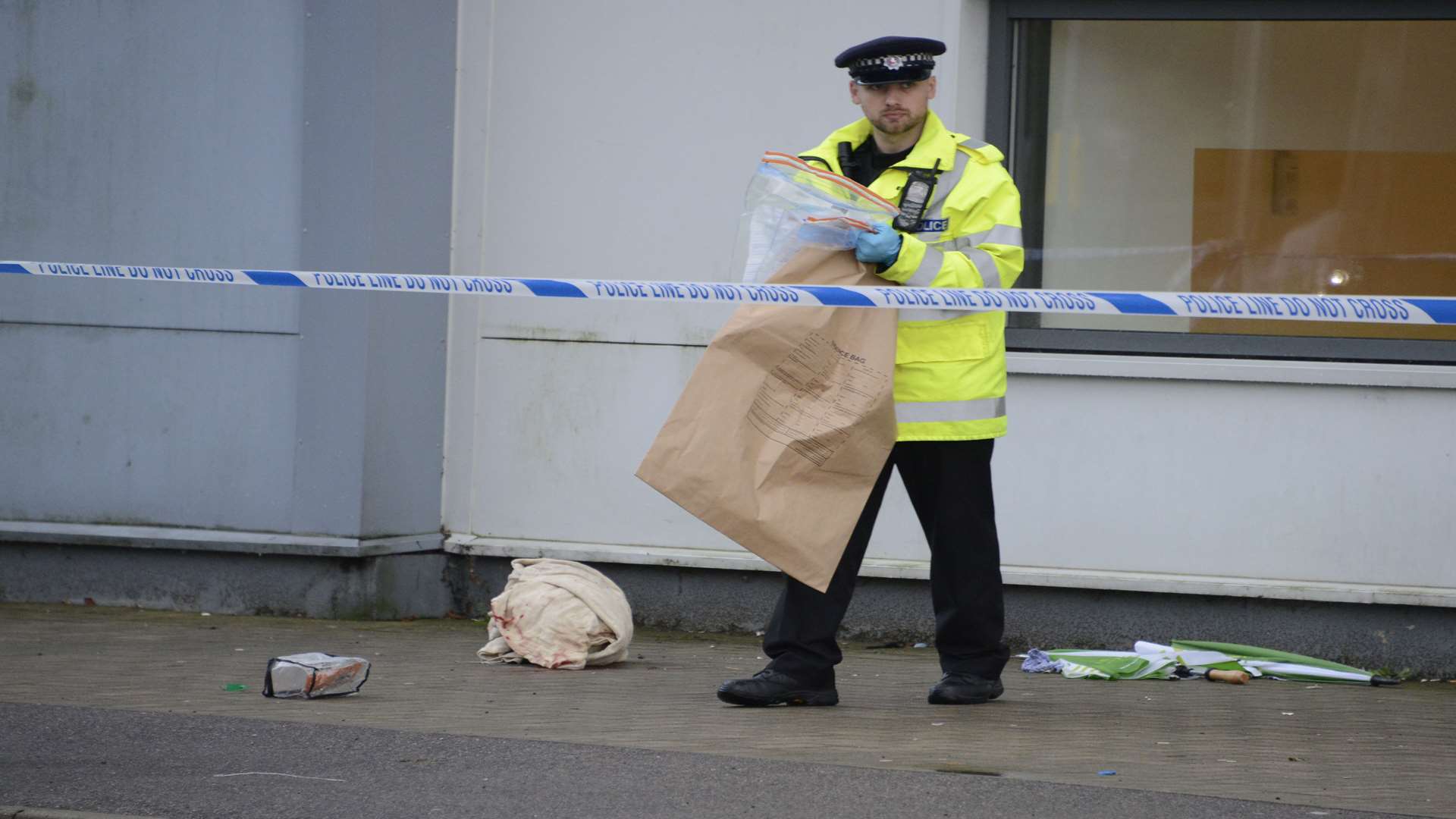 A police officer collecting evidence at the scene. Picture: Paul Amos.