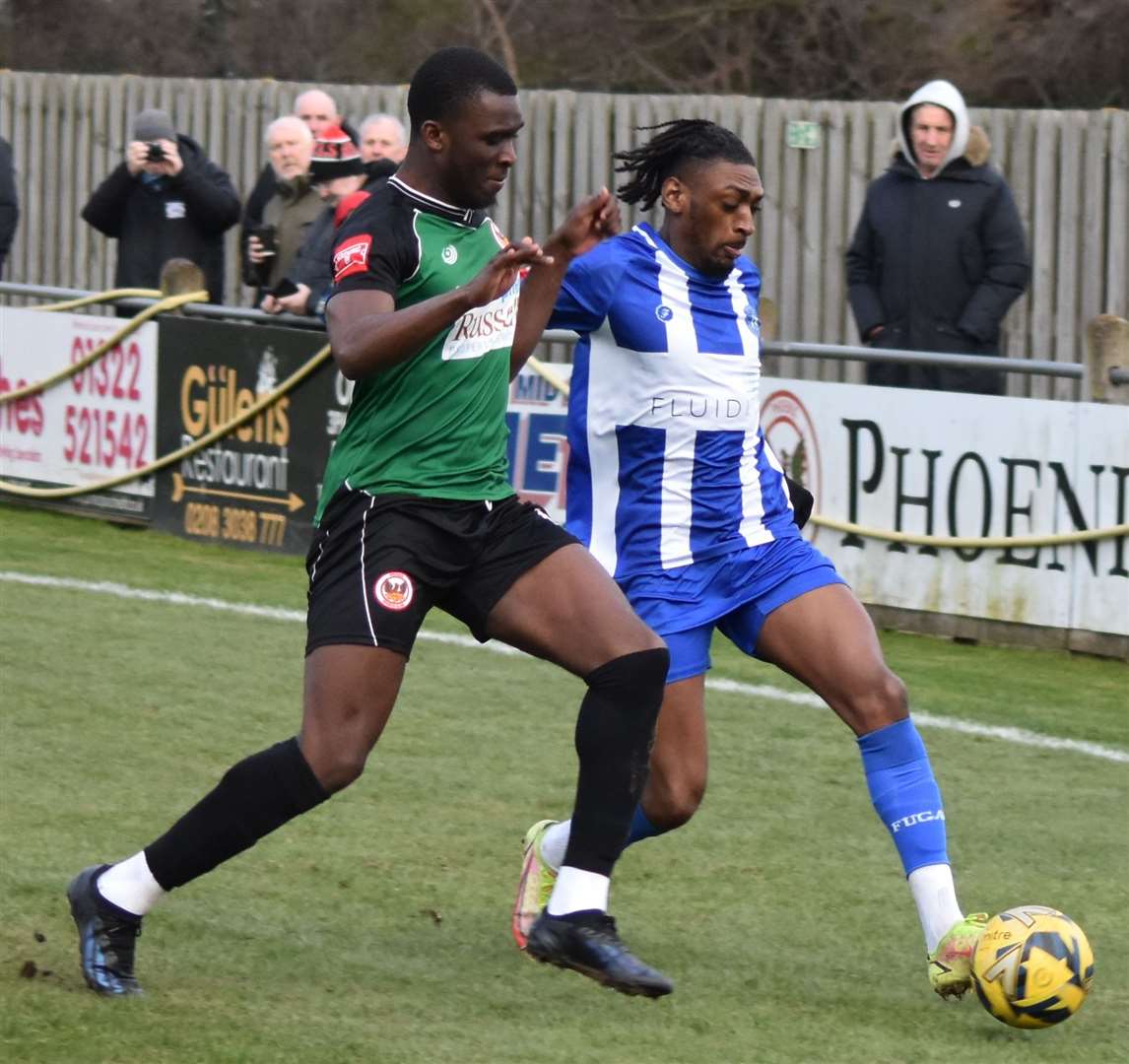 Herne Bay’s Gil Carvalho holds off a Phoenix challenge. Picture: Alan Coomes