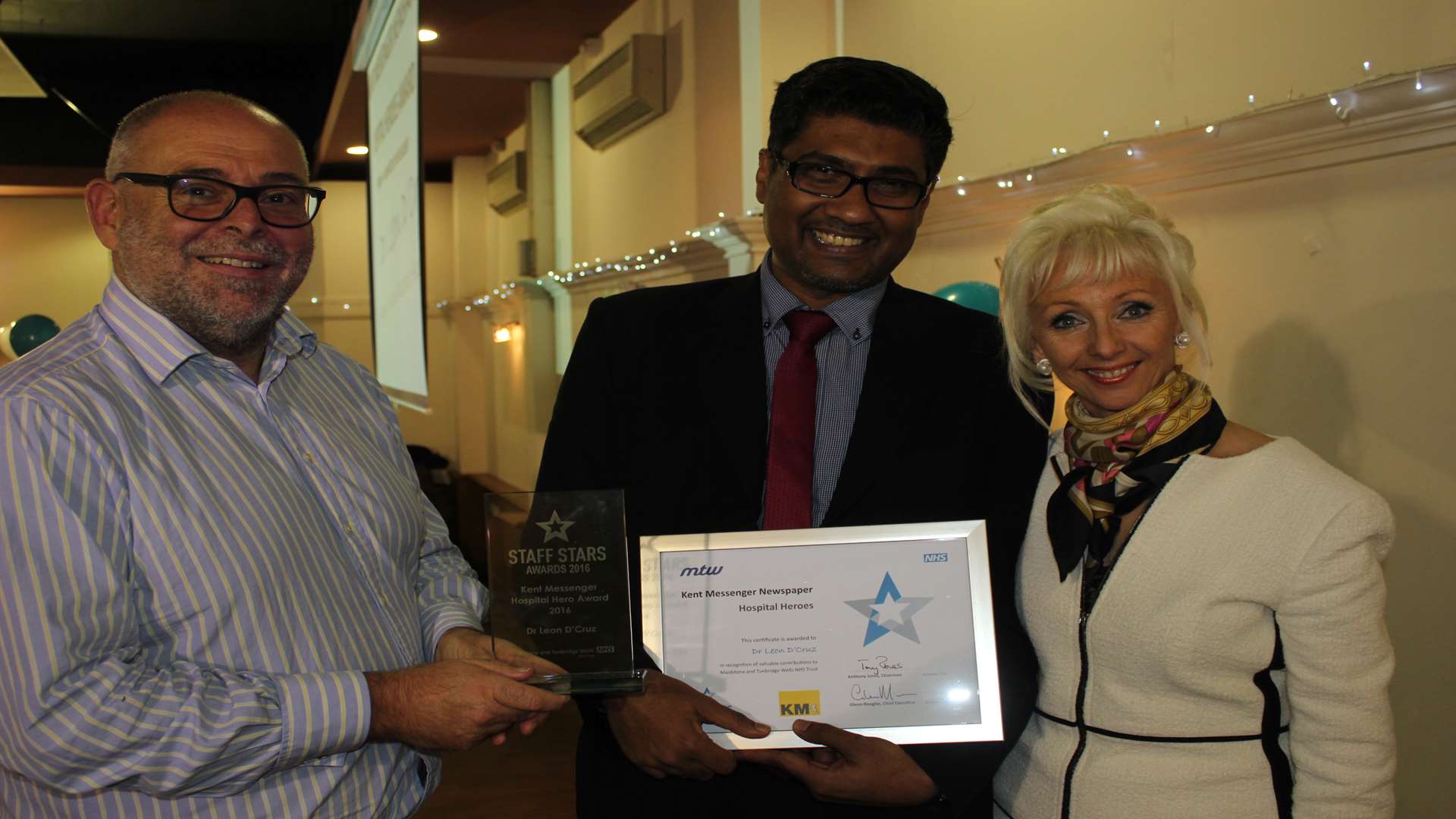 Dr Leon D'Cruz (centre) with Glenn Douglas, chief executive of the Maidstone and Tunbridge Wells NHS Trust and Debbie McGee