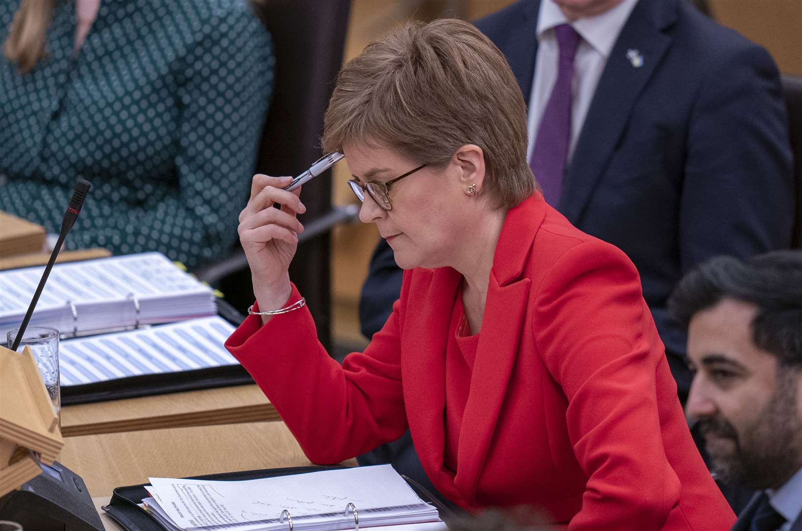Nicola Sturgeon faced scrutiny from Labour and Liberal Democrats following the announcement of more school strikes (Jane Barlow/PA)