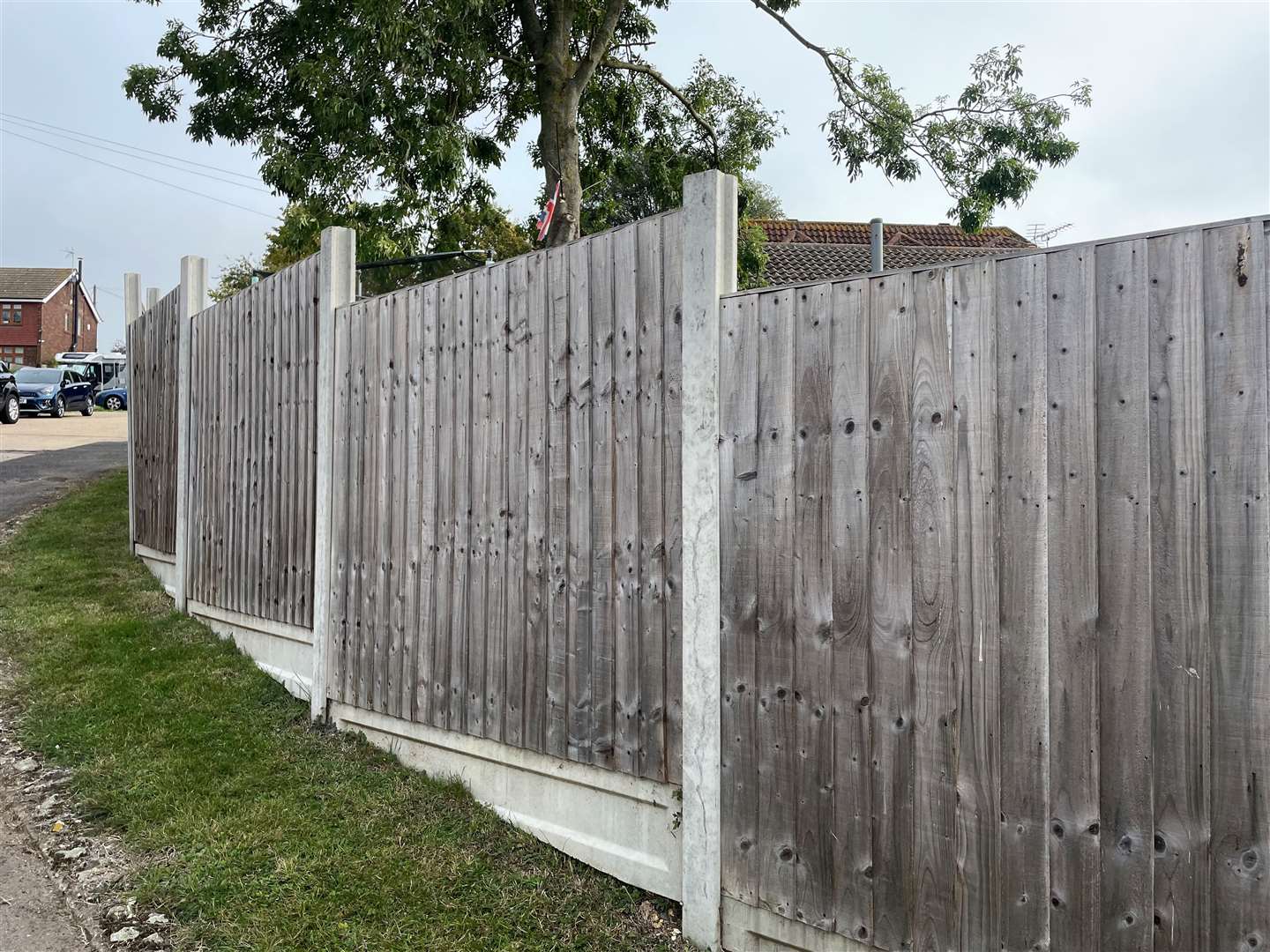 The fence surrounds the property but leaves a metre gap between it and street