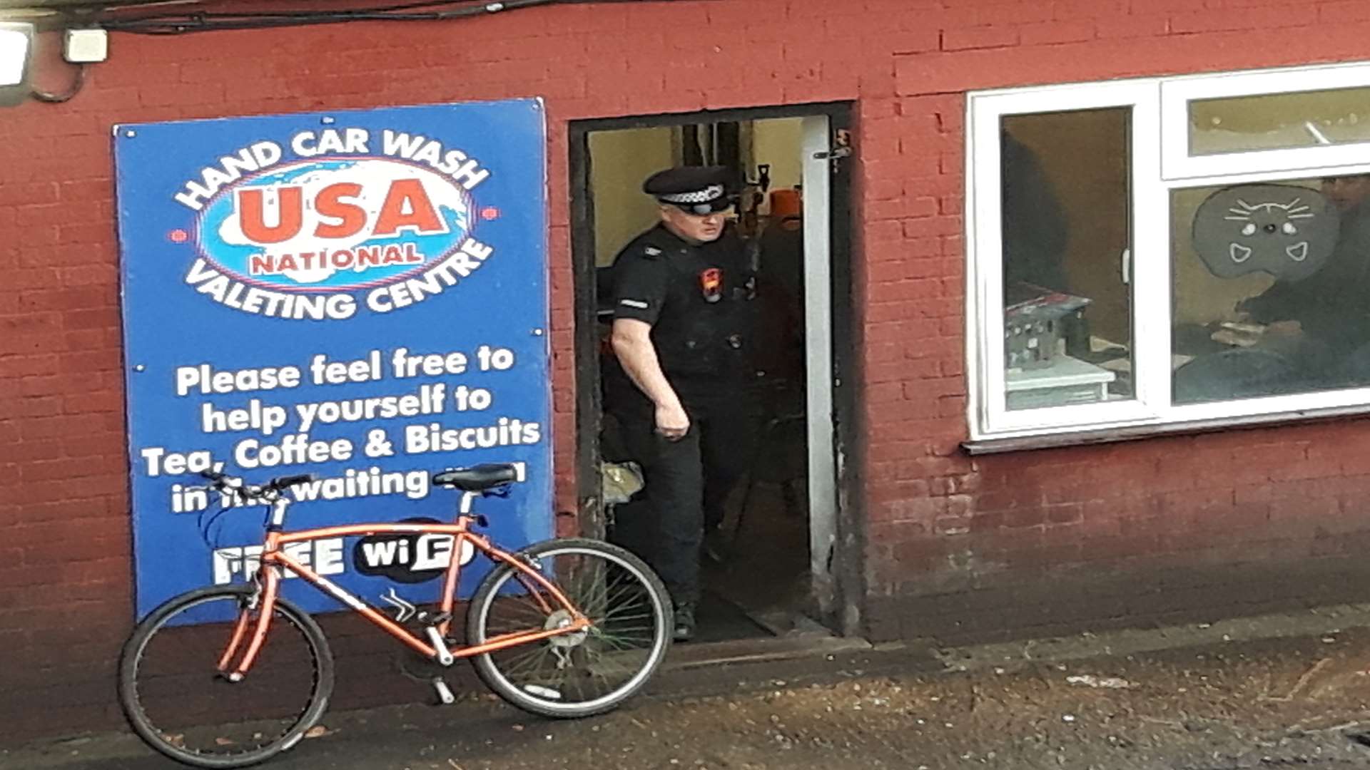 Police at the USA Hand Car Wash in Canterbury