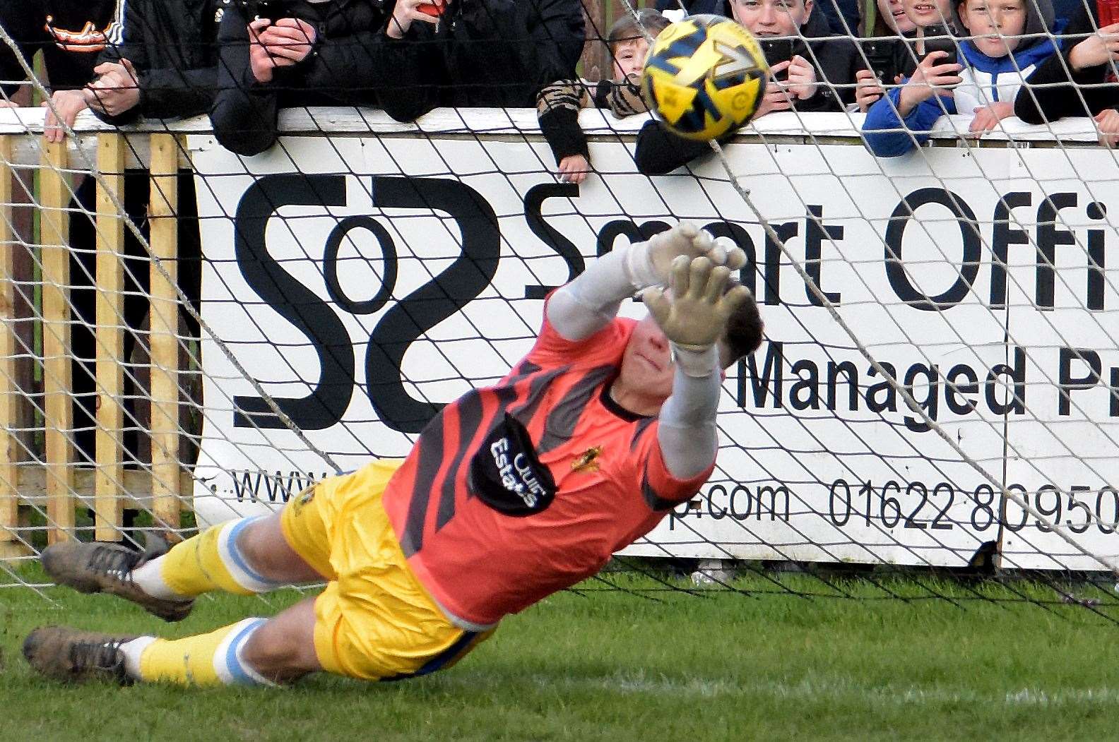 Stand-in keeper Harrison Pont saves Adebayo Akinfenwa's last-gasp penalty in Sittingbourne's 1-0 weekend win at Faversham. Picture: Randolph File