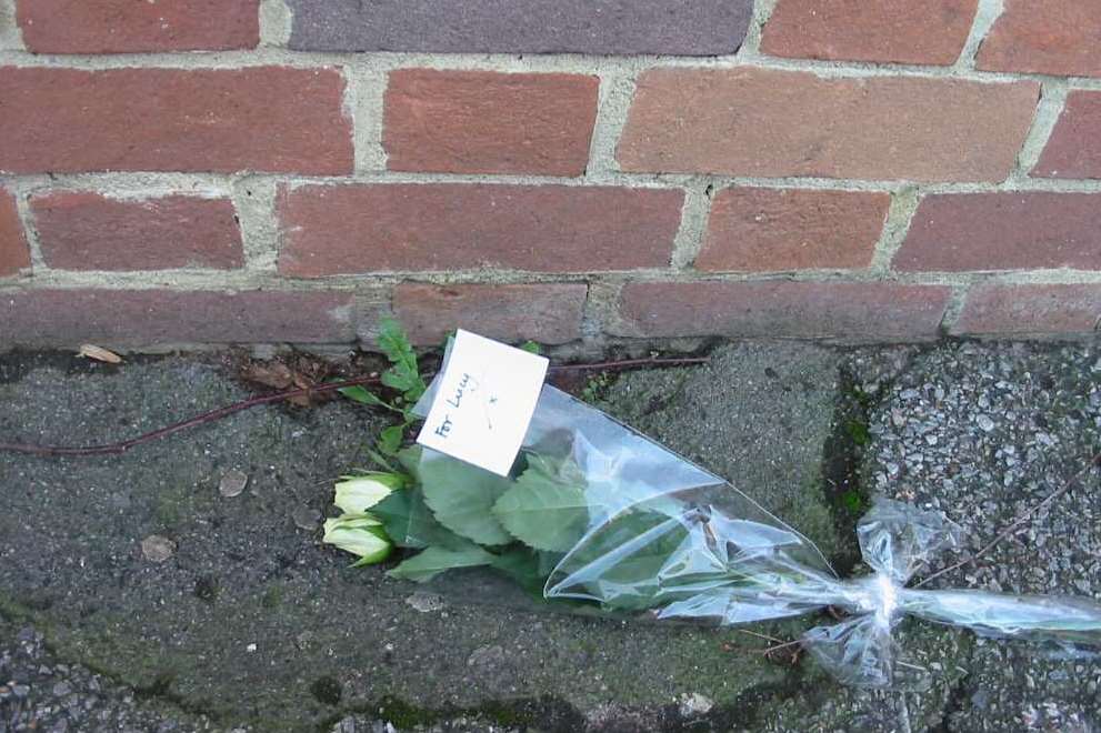 Flowers left in Bank Street to mark the seventh anniversary of the death of Lucy Grossmith, two.