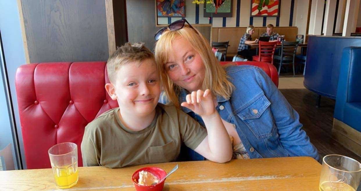Jade and son Reggie, eight, who has not been able to get to school since the family were moved to temporary accommodation 28 miles away in April