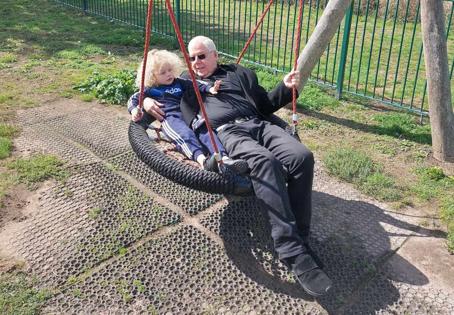Malcolm Sapsed playing with one of his grandchildren at the park. Picture: Lacey Hider