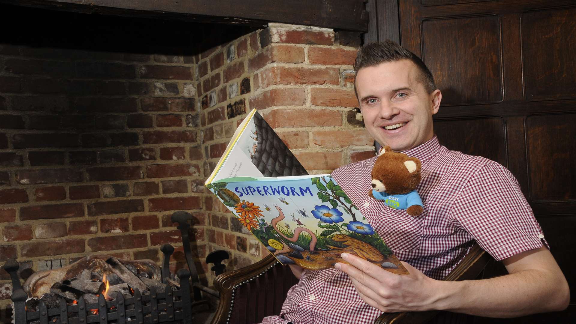 Phil Gallagher (star of CBeebies' Mister Maker) and KM Charity Team mascot Ted the bear.