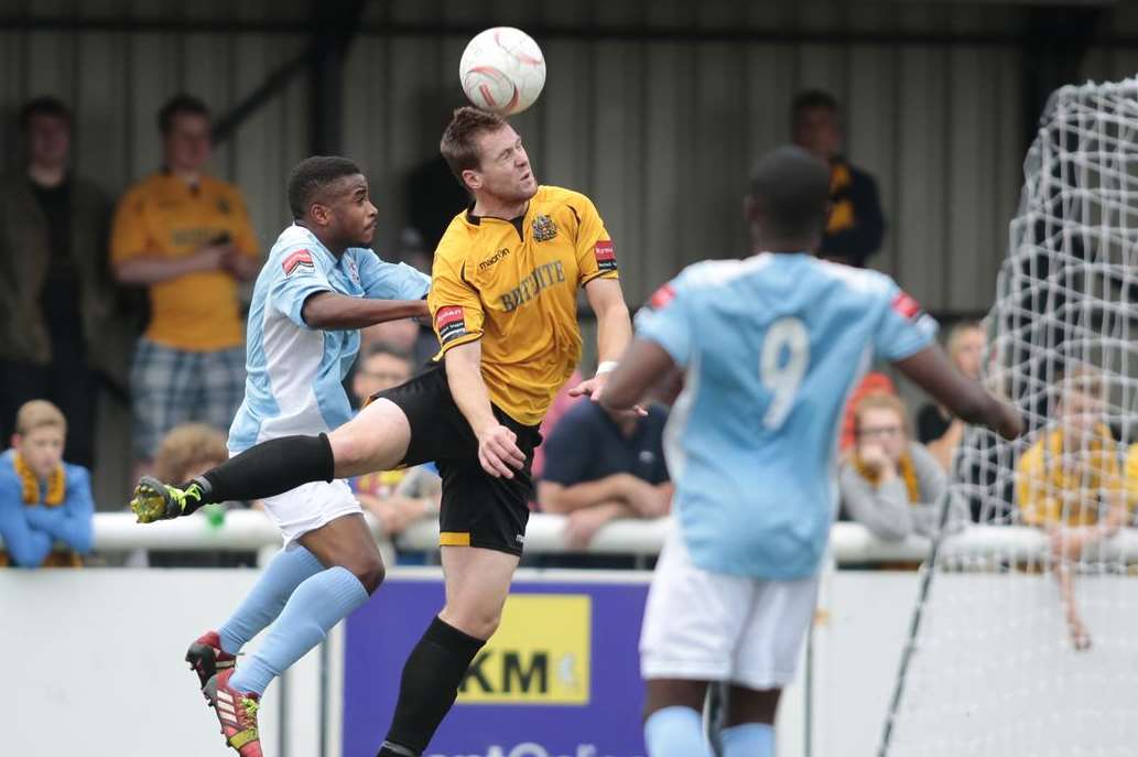 Maidstone defender Sonny Miles (amber) and Alex Akrofi (No.9) were never far apart at the Gallagher Picture: Martin Apps