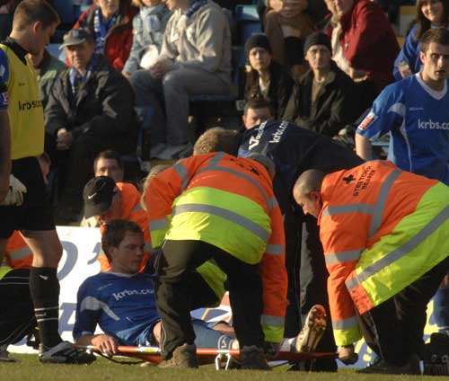 Simon King is stretchered off on Saturday. Picture: GRANT FALVEY