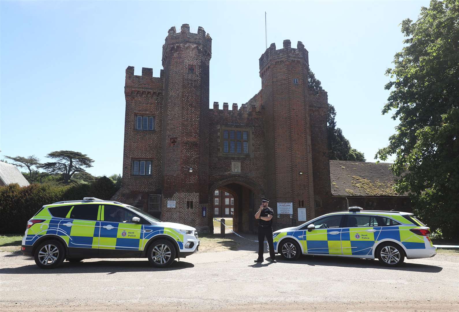 Police at the entrance to Lullingstone Castle in Eynsford, Kent (Yui Mok/PA)