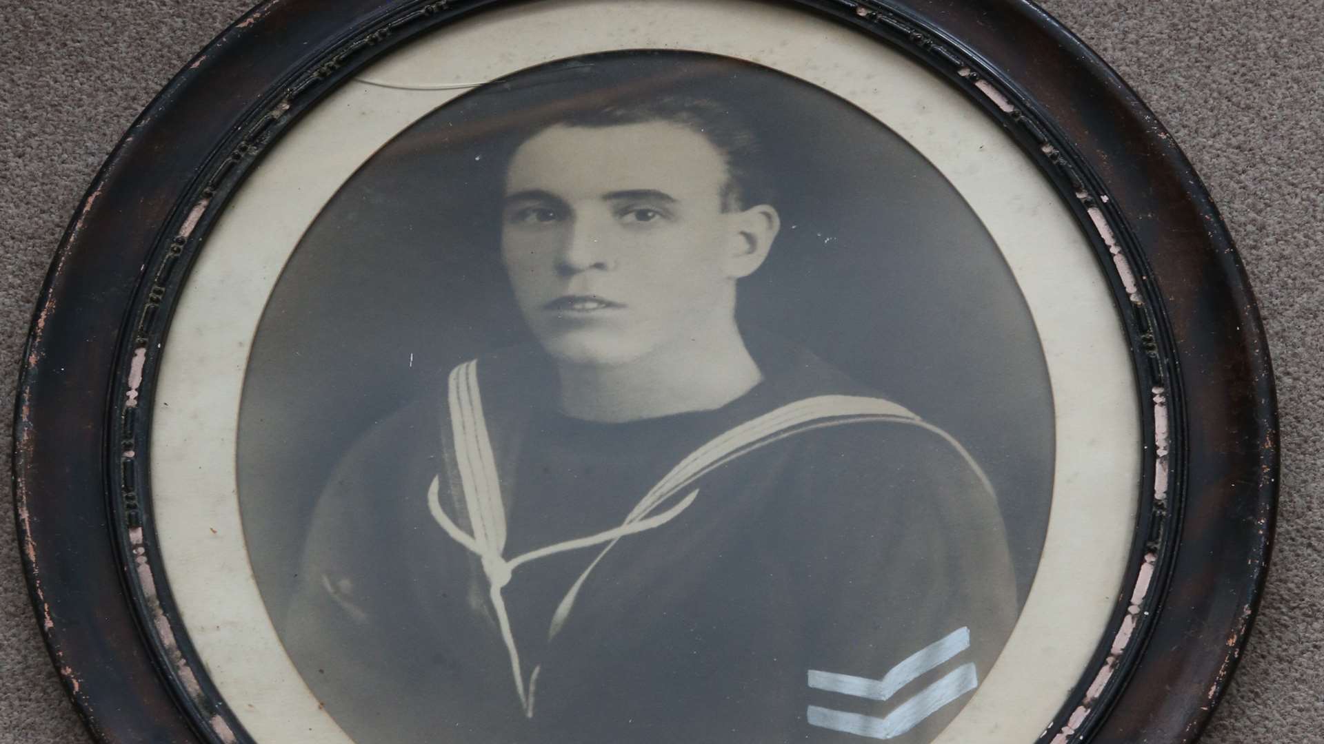 Do you recognise this sailor depicted in this framed portrait found hidden under floorboards?