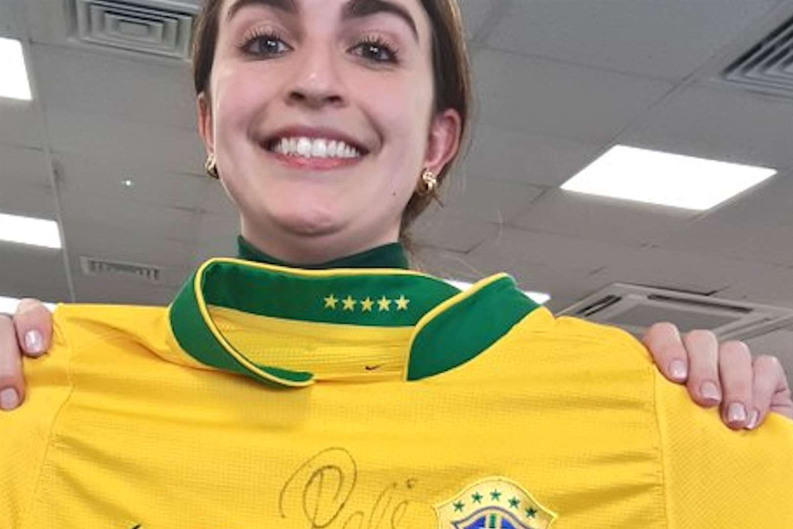 KentOnline reporter Juliana Cruz Lima with her lucky Pelé shirt