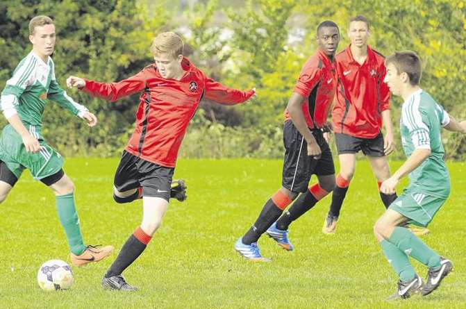 Rainham Kenilworth, in red, on the attack against Horsted Youth in their under-16 Division 1 match. Picture: Steve Crispe