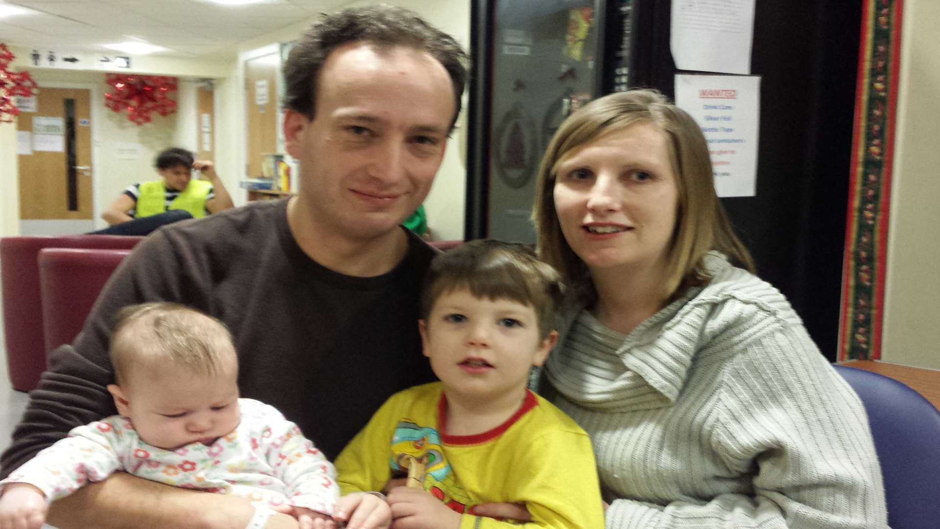 Guy and Julie Widdowson with children Joshua and Isabella at an emergency centre