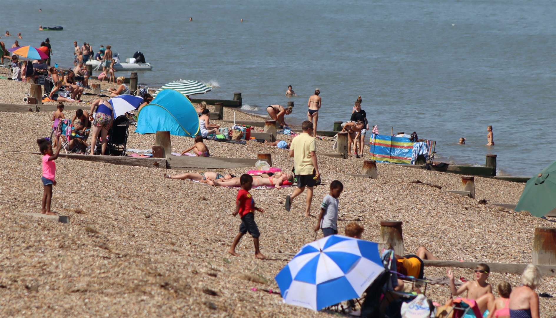Bathers at the Leas at Minster on the Isle of Sheppey on one of the hottest days of 2020