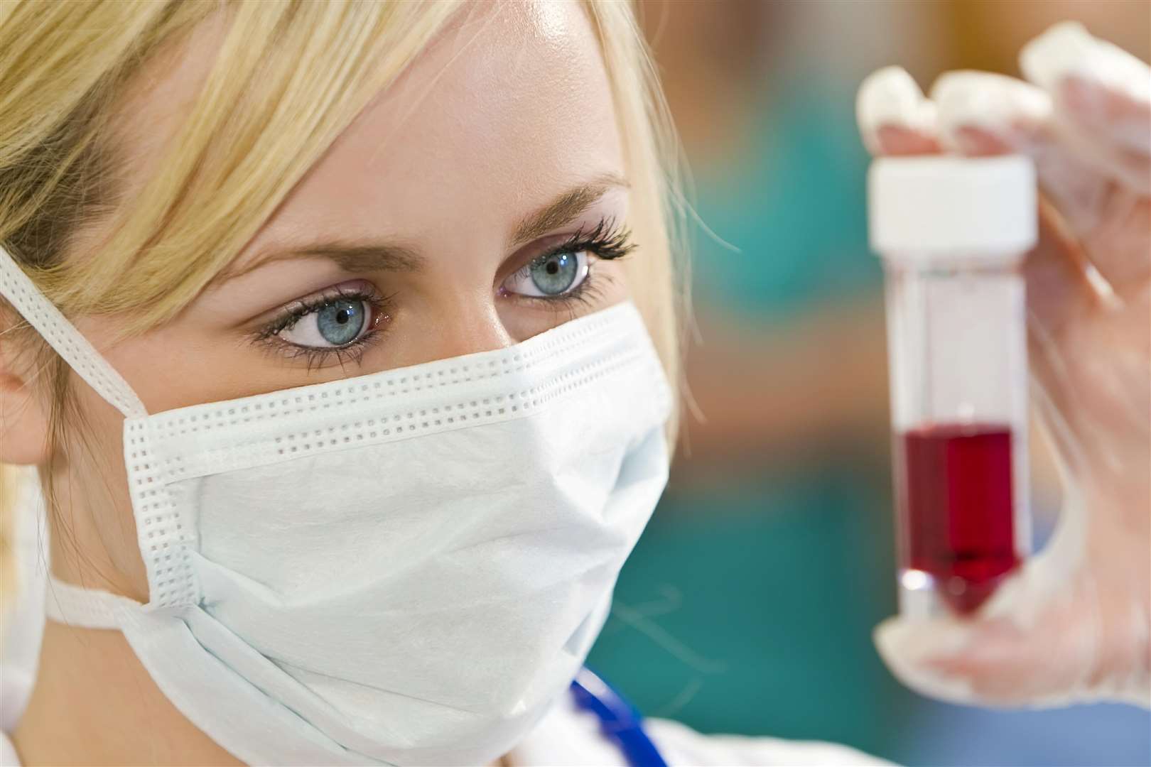A doctor looking at a blood sample
