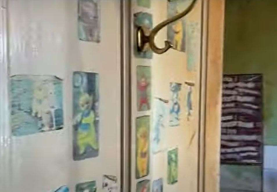 Teletubbies stickers on the kitchen door.  Image: Clive Emson / YouTube
