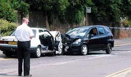 A police accident investigator at the scene of the crash