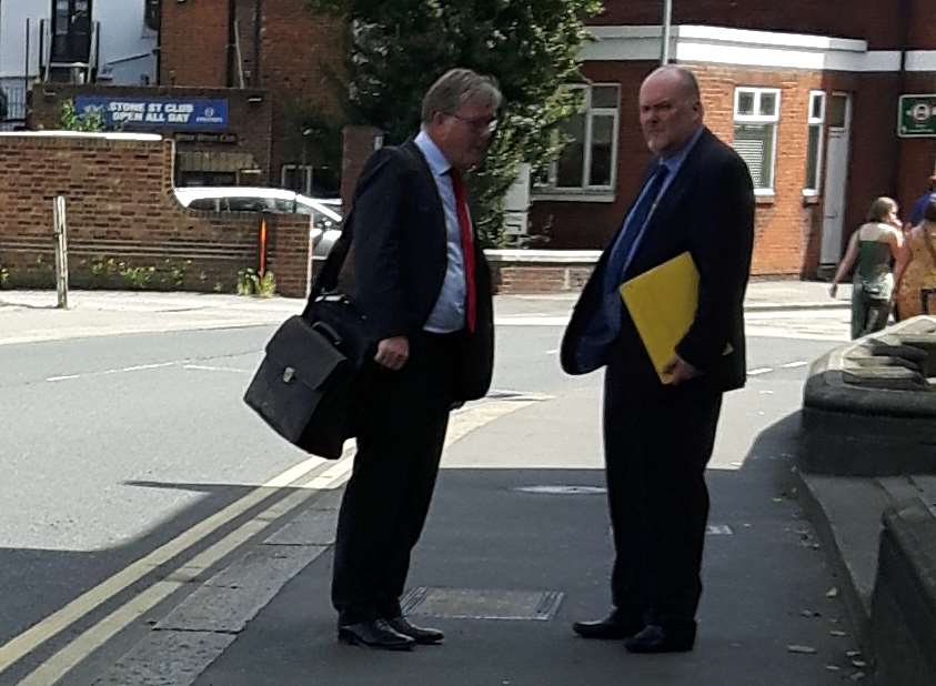 Grant Cordier (right) speaks to his solicitor outside court