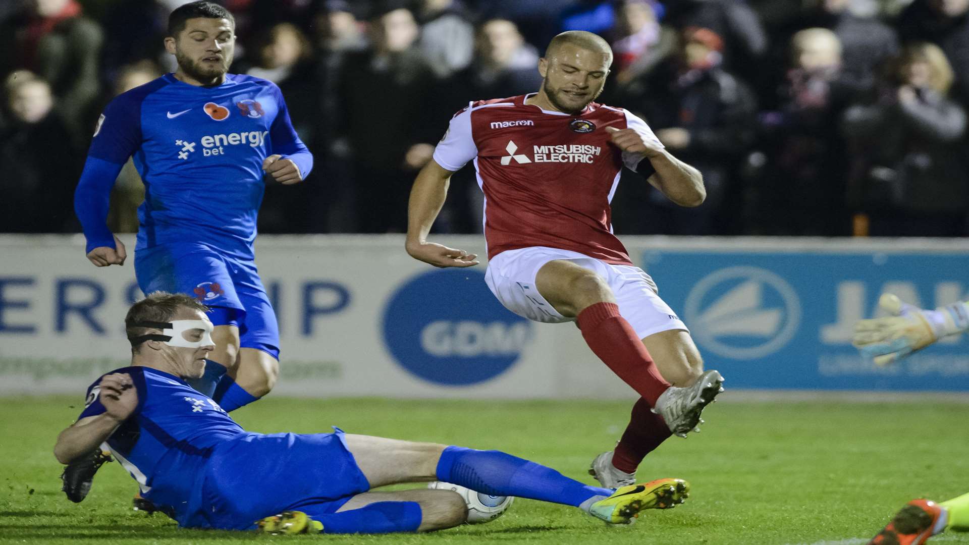 Luke Coulson is tackled by Leyton Orient's Mark Ellis Picture: Andy Payton