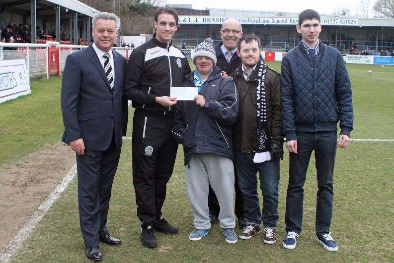 Chairman Jim Parmenter, left, and club midfielder Liam Bellamy presented the cheque to, from left, Jamie Clark, Ian Hulks, Jordan Mclester and Callum Speed
