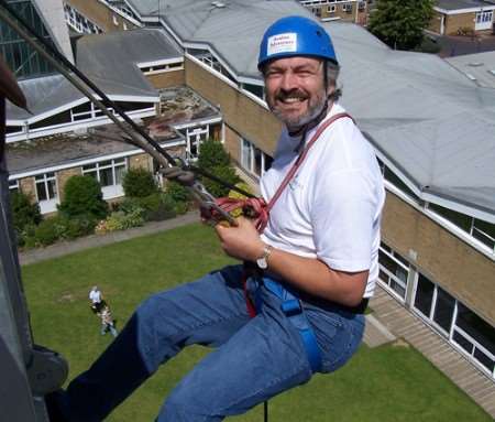 Stephen Parry from Parry Sharratt Solicitors abseils from Fisher Tower, Canterbury.
