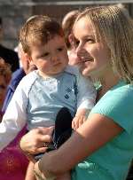 Carly Sykes pictured with son Thomas at the Kent Senior Cup final last month. Picture: GARY BROWNE