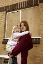 Julie Robinson and her daughter Chloe outside their home