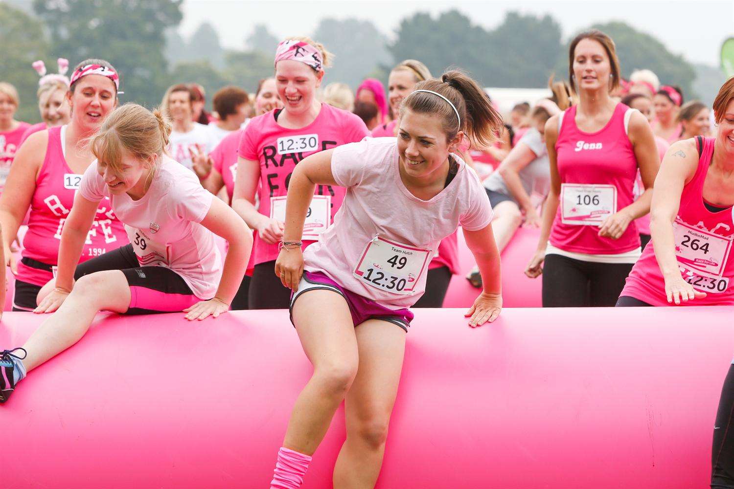 Runners reach the first obstacle at the Pretty Muddy event held in Mote Park, Maidstone.