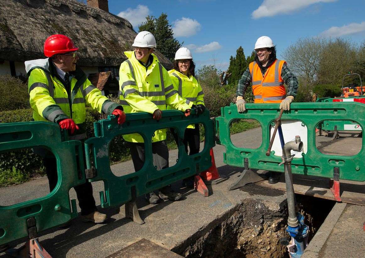Cllr Baldock, right, talks to staff from South East Water and Clancy Docwra about the Borden engineering work earlier this year. Picture: South East Water